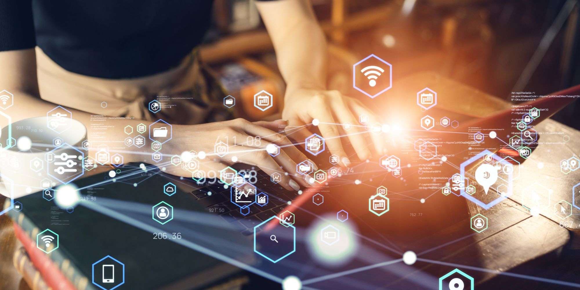 Hands typing on a laptop surrounded by digital icons representing AI technology and data management.