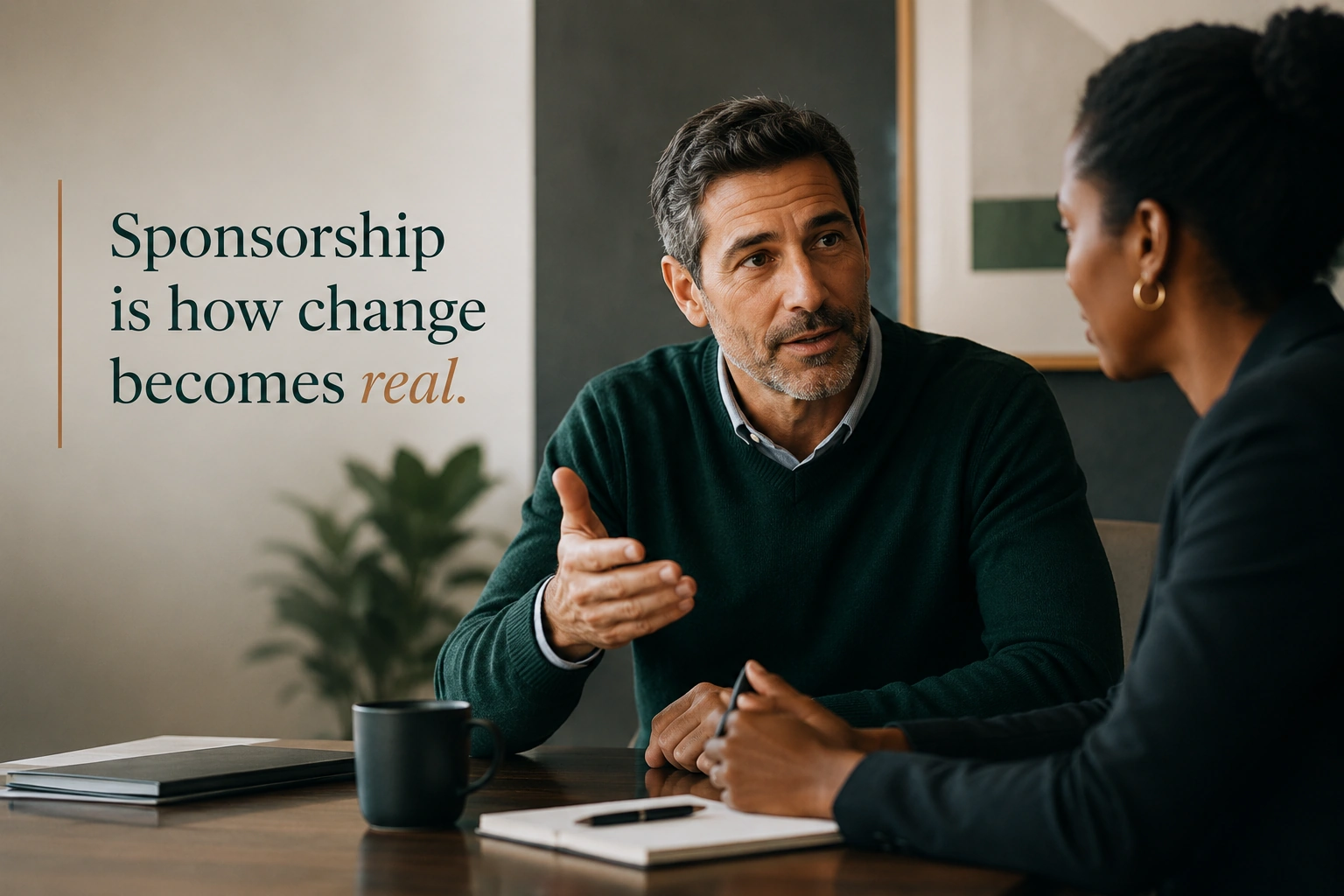 A team leader in conversation with a colleague, in the middle of a real change