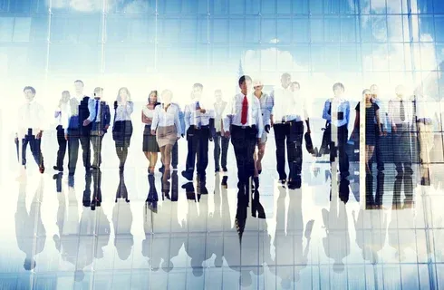 Business professionals walking confidently in a modern setting, illustrating strong sponsorship